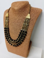 Collar Avalon de cuentas negras y doradas boho – La Gata Voladora